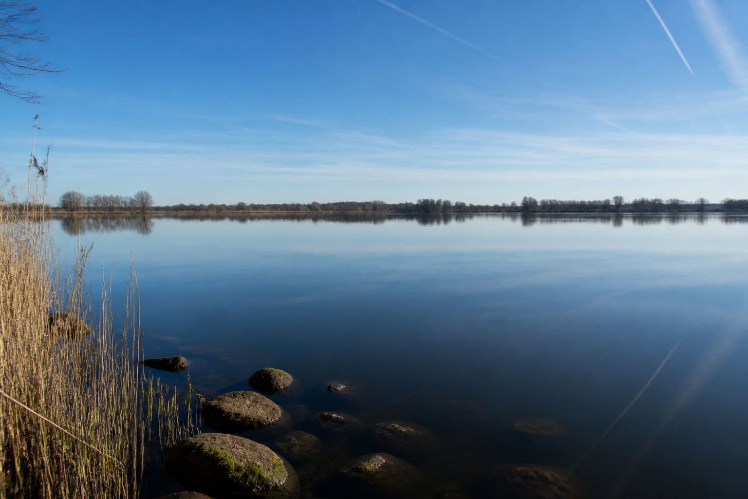 A bright, flat-calm high-pressure morning — often harder bottom-bait fishing